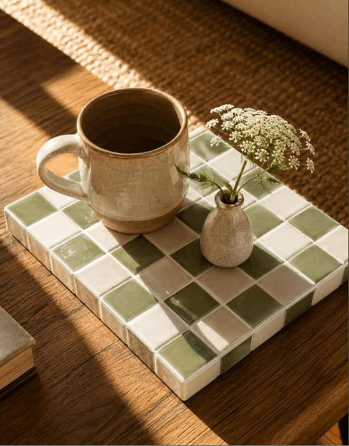 Ceramic mug and bud vase on a tile tray