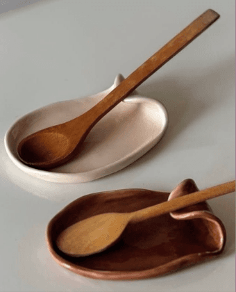 Wooden spoons on ceramic dishes