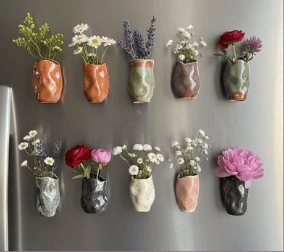 Magnetic bud vases on a fridge